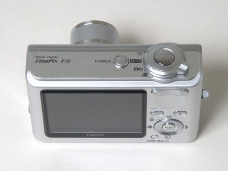 A Fujifilm FinePix F10 digital camera displayed against a plain background, focusing on the back view with the large LCD screen and control buttons visible.