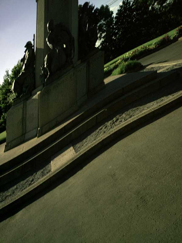 Photo taken with a Goodmans G-Shot 3027TFT camera showing a dark image of statues on a monument with steps leading up to them, demonstrating the camera's low-light performance.