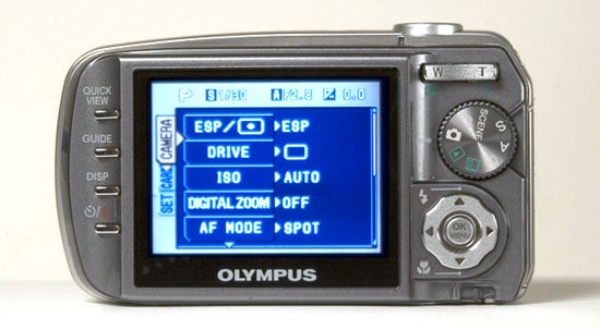 Olympus µ [mju] Digital 800 camera showing the back view with the LCD screen on and various camera settings displayed, such as ESP, drive mode, ISO setting, digital zoom off, and autofocus mode set to spot. The physical navigation buttons and dial are on the right of the screen.