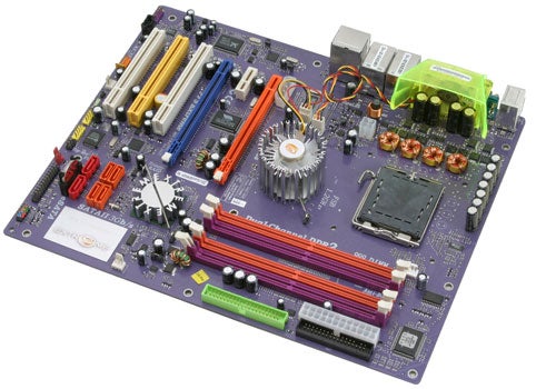 ECS PF5 Extreme Intel motherboard with capacitors, heatsinks, RAM slots, and CPU socket visible on a purple PCB.