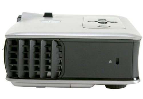 Side view of a Dell 3400MP DLP projector showing its control panel and ventilation grille.