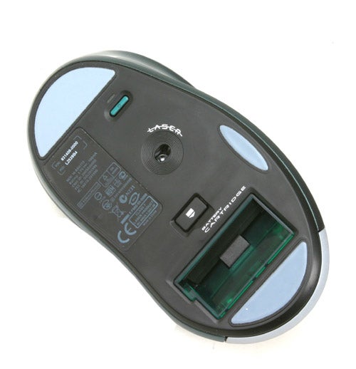 Bottom view of a Logitech G7 cordless 2000dpi laser mouse showing the laser sensor, battery compartment, and model information.