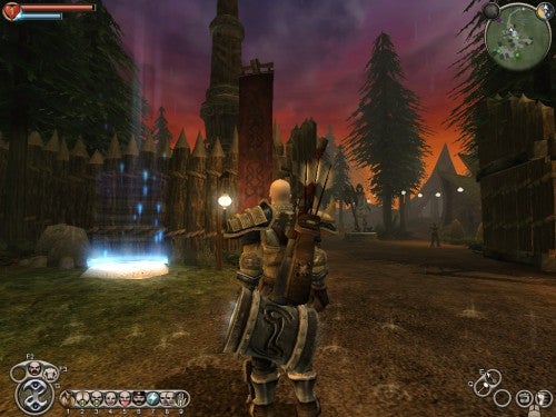 Screenshot from the game Fable: The Lost Chapters showing the player character from a third-person perspective, standing on a dirt path with a forested area and a teleportation portal glowing blue in the background. Game HUD is visible with health bar, mini-map, and ability icons.