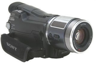 Sony HDR-HC1E High Definition Camcorder displayed on a neutral background, featuring a Carl Zeiss lens and black exterior design with prominent Sony branding.