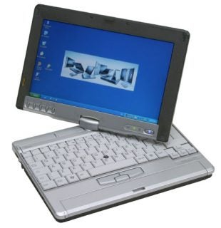 Fujitsu-Siemens Lifebook P1510 convertible tablet laptop with screen rotated and Windows desktop visible, QWERTY keyboard, silver casing, and stylus holder on the side.