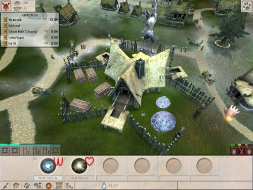Screenshot of Black & White 2 gameplay showing village and interface.