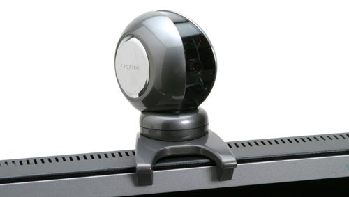 Creative WebCam Live! Motion camera mounted on top of a computer monitor, featuring a round design with a silver and black color scheme.