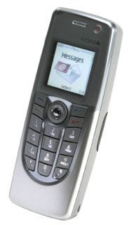 Nokia 9300 smartphone with the screen displaying the messages menu, showcasing the classic Nokia user interface on a silver keypad mobile phone.