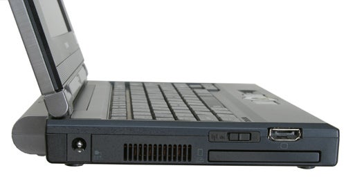 Side view of a Toshiba Libretto U100 laptop showing the ports and cooling vents with the screen partially open.