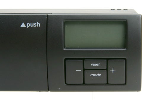 Close-up of Akasa AllInOne AK-ALL-01BK fan controller with LCD screen, push button, and mode and reset buttons.