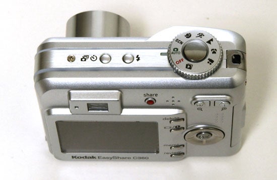 Kodak EasyShare C360 digital camera displayed on a white background, featuring the silver body, top control dial, 'share' button, and rear LCD screen.