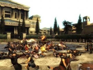 Screenshot of a battle scene from the video game Spartan: Total Warrior, showing a character fighting multiple enemies in an ancient city courtyard.
