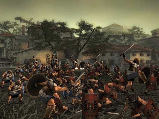 In-game screenshot of Spartan: Total Warrior depicting a chaotic battle scene with multiple characters fighting, including warriors with shields and spears in a Mediterranean ancient city environment.