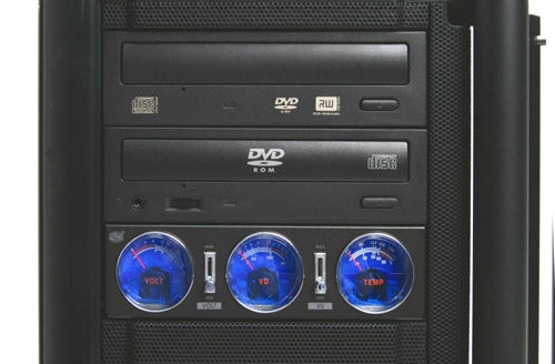 Front panel of the Mesh Xtreme Essential TRX Gaming PC with DVD ROM drive, USB ports, and three blue illuminated fan control dials showing VOLT, FAN SPEED, and TEMP indicators.