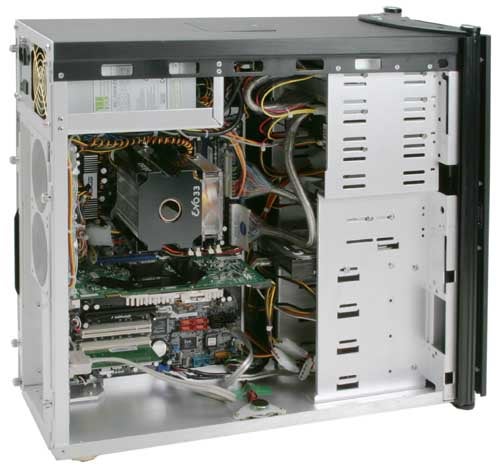 Open computer case displaying internal components of Mesh Xtreme Essential TRX - Gaming PC, including motherboard, RAM, CPU cooler, power supply, and various cables.
