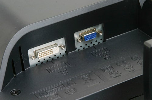 Close-up view of the input ports on the back of a BenQ FP202W 20-inch widescreen monitor, showing a DVI connector on the left and a VGA connector on the right.