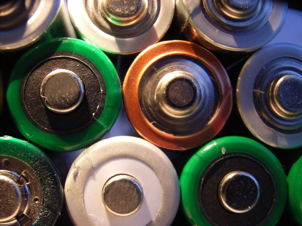 Close-up of various AA batteries showcasing different brands and colors.