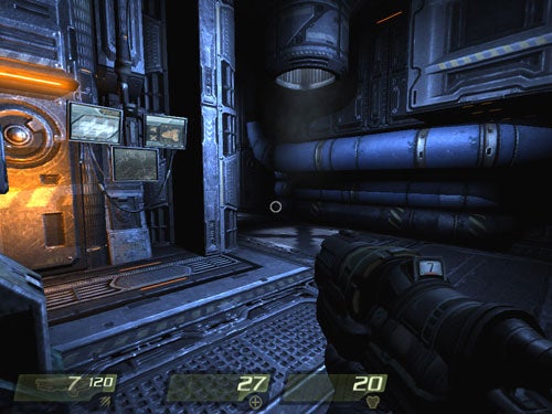 First-person view screenshot from the video game Quake 4, showing a detailed corridor environment from within the game with metallic walls and futuristic design, and a weapon held in the player's hand visible in the foreground. HUD elements indicate ammunition and health levels.