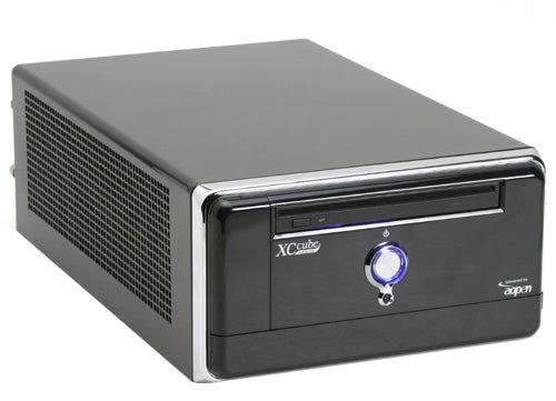 AOpen XC Cube MZ915-M Small Form Factor Barebone PC with front-facing power button illuminated in blue, black body, and prominent XC cube branding on front panel.