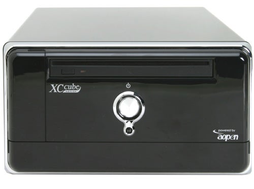 AOpen XC Cube MZ915-M Small Form Factor Barebone PC with shiny black casing, front optical drive bay, and prominent power button with AOpen branding.