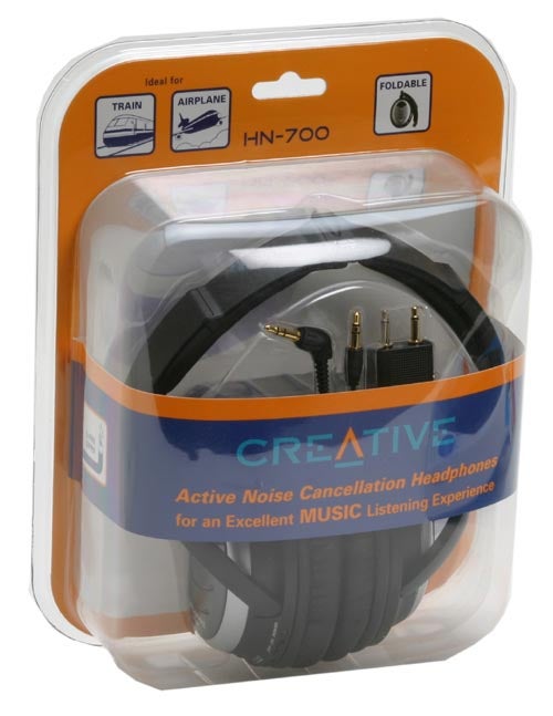 Creative HN-700 noise-cancelling headphones packaged in a clear plastic case with orange and blue accents, highlighting active noise cancellation feature for music listening, with the product foldable and ideal for train and airplane use.