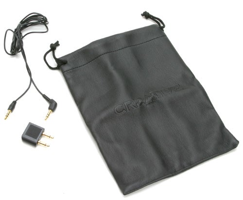 Creative HN-700 noise cancelling headphones accessories including a black carry pouch and audio cables with adapters.