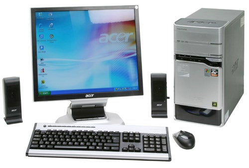 Acer Aspire E300-7NB73 desktop computer setup with a monitor, keyboard, mouse, and speakers displayed on a white background.