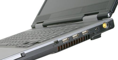 Side view of an open Rock Pegasus 650 laptop showing multiple ports including USB and audio out.
