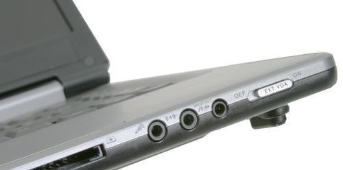 Close-up of the side panel of a Rock Pegasus 650 laptop showing multiple ports and switches including audio jacks and a VGA port.