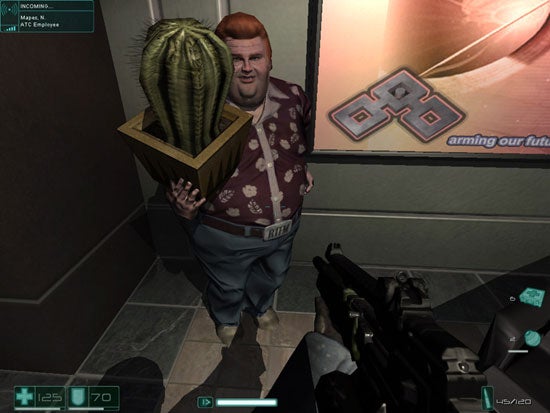 Screenshot from the video game F.E.A.R. First Encounter Assault Recon showing an in-game character holding a potted cactus with a humorous expression, from the player's perspective with a visible gun and health stats.