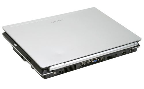 Toshiba Qosmio G20 laptop closed, showing silver cover and side ports including USB, video out, and audio jacks.