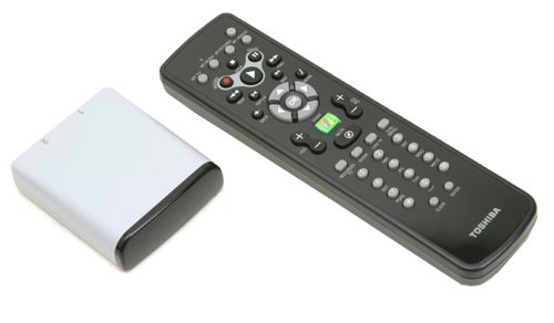 Toshiba Qosmio G20 external hard drive and black multimedia remote control on a white background.
