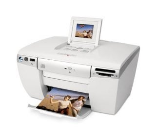 Lexmark P450 Photo Printer with printed photograph emerging from the output slot and a small LCD screen displaying an image preview.