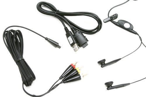 Several cables and accessories likely for the Samsung SGH-D600 phone, including a charger, USB cable, and earphones with in-line control on a white background.