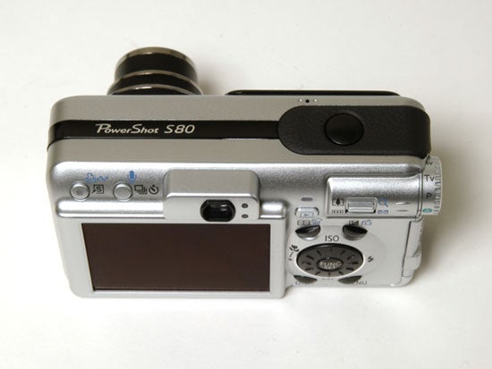 Canon PowerShot S80 digital camera displayed on a white background showing its rear LCD screen, control buttons, and dial.