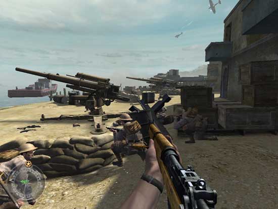 In-game screenshot from Call of Duty 2 showing a first-person perspective with a player holding a rifle on a World War II battlefield. There are sandbag barricades, a mounted machine gun, and soldiers in period uniforms in the background, with a coastal environment and flying aircraft overhead.