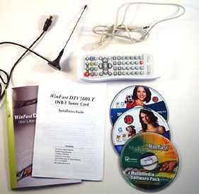 Leadtek DTV1000 T Digital TV Tuner product contents including remote control, antenna, installation guide, and software CDs on a white surface.