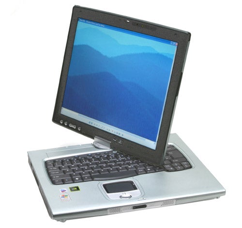 Acer TravelMate C312XMi Tablet PC with a swivel screen in an upright position displaying a blue wallpaper, showcasing the full keyboard and touchpad.
