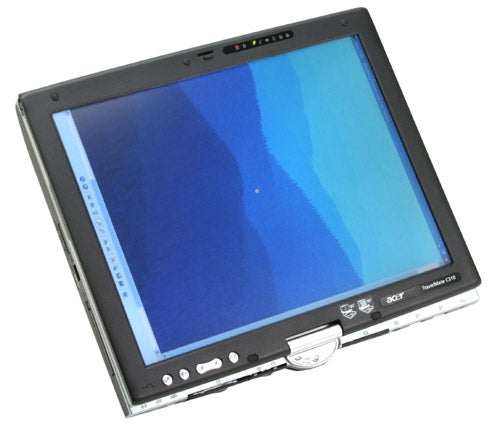 Acer TravelMate C312XMi tablet PC positioned upright with stylus, displaying a blue screen.
