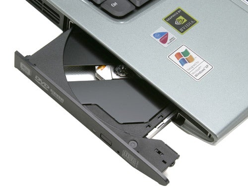 Close-up of Acer TravelMate C312XMi Tablet PC's side showing the DVD drive open.