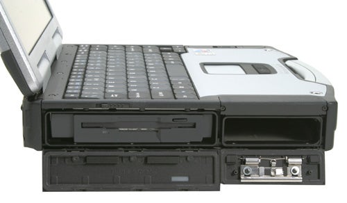 Panasonic ToughBook CF-29 rugged laptop partially opened, showing the keyboard, touchpad, and the durable black casing with ports visible.