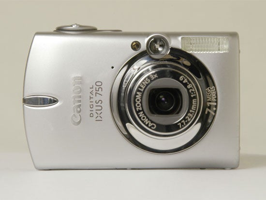 Canon Digital IXUS 750 camera with a closed lens and built-in flash, displayed against a neutral background.