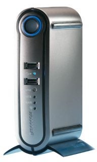 Freecom FSG-3 Storage Gateway vertical-standing silver device with a circular blue button, USB, eSATA, and WAN ports on the front panel.