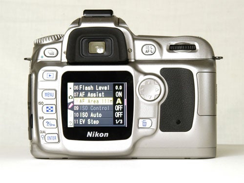 Nikon D50 DSLR camera with 18-55mm lens featuring settings display on LCD screen.