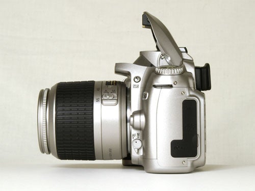 Nikon D50 DSLR camera with a 18-55mm lens viewed from the left side against a neutral background.