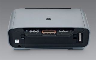 Canon Pixma MP170 inkjet printer on a neutral background showing control panel and input/output trays.