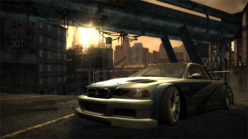 A screenshot from the video game Need for Speed: Most Wanted (2005) showing a modified BMW M3 GTR in a street racing scene with urban surroundings and a sunset in the background.