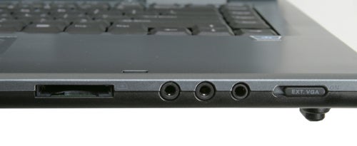 Close-up of an Alienware Area-51 m5500 laptop's side ports, including USB slots, audio jacks, and an external VGA port.