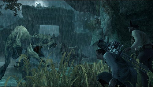 A screenshot of a King Kong themed video game, showing two characters hiding in tall grass with weapons aimed at a large dinosaur creature in a rainy jungle environment.
