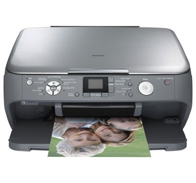 Epson Stylus Photo RX520 inkjet printer with a color photo printout lying in its output tray.